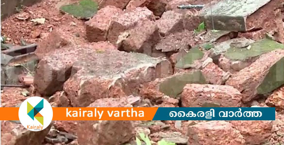 കണ്ണൂരിൽ കനത്ത മഴയിൽ കെട്ടിടവും മതിലും തകർന്നു